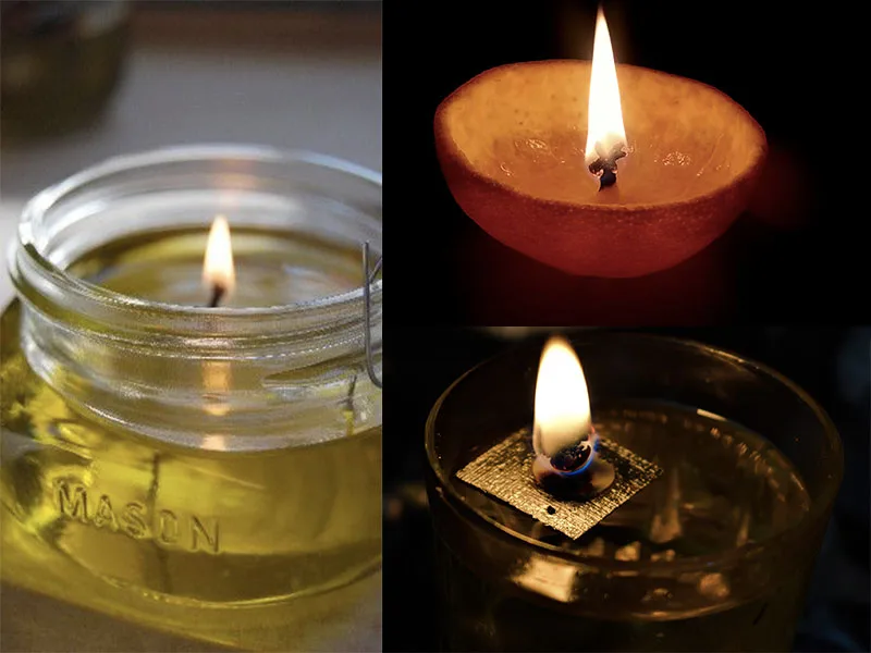 Candela accesa realizzata con olio d'oliva in un contenitore di vetro